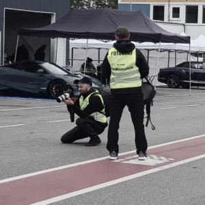 A picture of two photographers at Mantorp Park taking photos at a Trackday event by Drivers Club